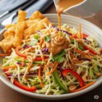 Vibrant Asian-Inspired Crunchy Cabbage Salad with Creamy Peanut-Ginger Dressing